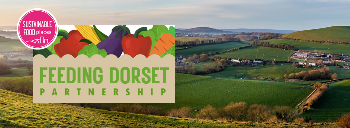 Feeding Dorset Partnership logo set on an area of Dorset's rolling hillside landscape.