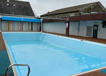 Image of lido pool with no water as it's prepared for cleaning.